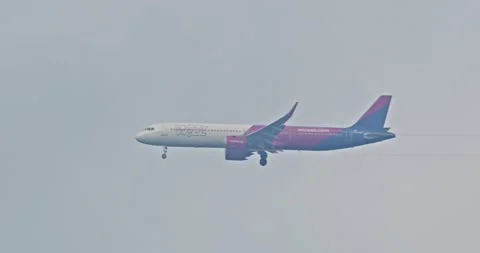 Airplane in cloudy sky in slow motion. Jeziorna/Poland-11/17/2024 Video stock 296188622