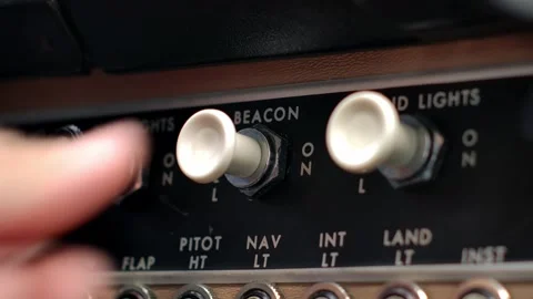 Airplane Cockpit Beacon Light Push Pull Switch Actuated by Pilot Hand Video stock 307379228