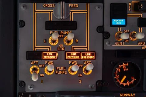 Airplane cockpit fuel panel with pump switches and valve controls Stock Photos