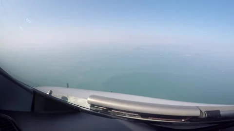 Airplane cockpit point of view islands Stock Footage 248035474