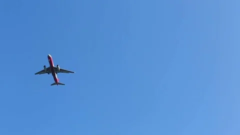 The airplane comes on landing against a clear blue sky Stock Footage 81191353