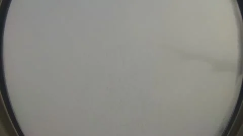 Airplane Coming Out of Clouds into Sun Stock Footage 11147720