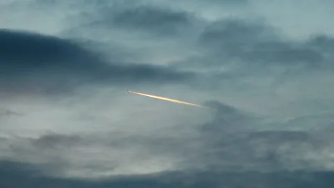 Airplane with a contrail disappears in the cloud Vídeo Stock 220840524