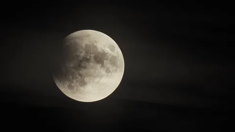 Airplane With Contrails In Font Of The Full Moon At Partial Lunar Eclipse Stock Footage 112507101