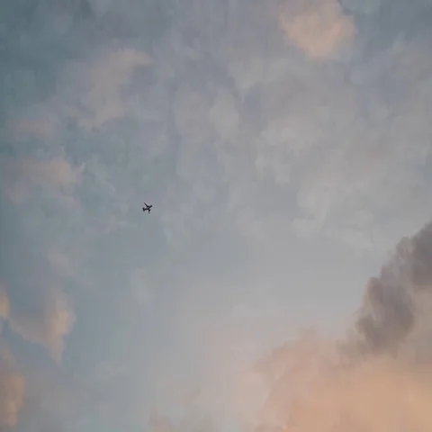 Airplane cross sky Stock Footage