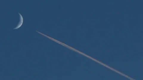 Airplane crossing the moon Stock Footage 70286276