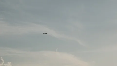 Airplane is crossing the sky and second aircraft far away in a highest altitude Video stock 108883902