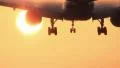 Airplane crossing the sun at sunrise HD Footage