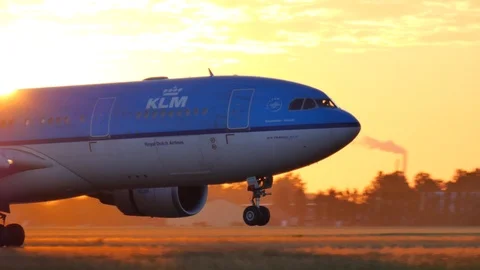 Airplane crossing the sun while landing Stock Footage 114505704