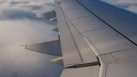An airplane decendes into the clouds 4k 25 fps video Stock-Footage 257543009