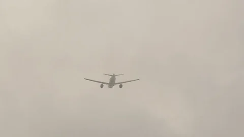 Airplane disappearing in the mist. Stock Footage 81530010