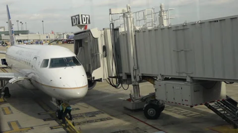 An airplane is docking to the jetway. Stock Footage 54566414