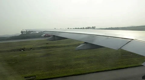 Airplane driving to starting area in Kuala Lumpur and waits for take off Stock Footage 37107341