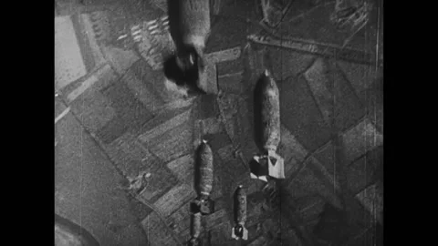 Airplane dropping bombs during World War... | Stock Video | Pond5