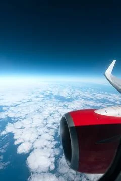 Airplane Engine Above the Clouds Stock Photos
