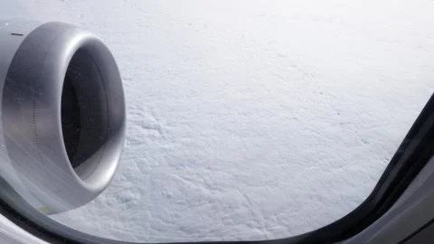 Airplane engine above a compact white cloud layer. frozen landsc Stock Footage 339353141