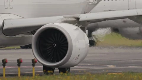 Airplane engine exhausting hot air on runway Stock Footage 306350704