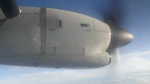 Airplane Engine with propeller during flight in the sky Stock Footage 63948909