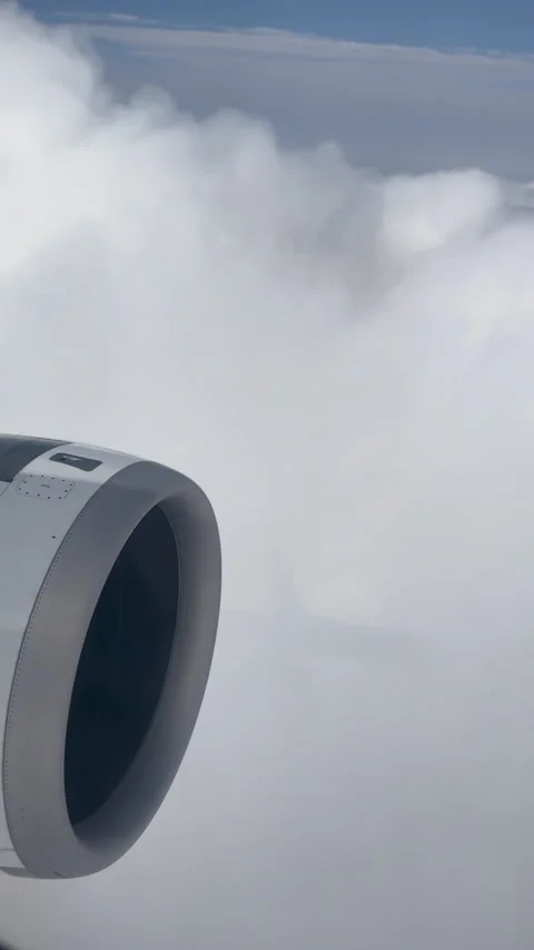 Airplane engine seen from a window flying high above Stock Footage 338385235