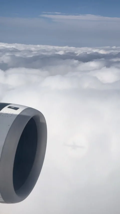 Airplane engine seen from a window flying high above Stock Footage 338386012