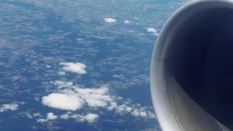 Airplane engine spinning in flight on sunny day Stock Footage 299500964