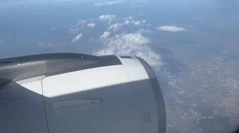 Airplane Engine View Above Clouds in Clear Sky Video stock 310717575