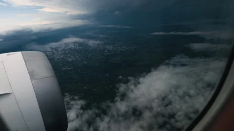 Airplane engine view above clouds at dusk over Paraguay landscape Vidéo 334593501