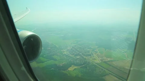 Airplane engine, view from the body. City in the background Stock Footage 163085494