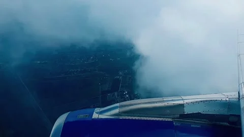 Airplane entering clouds with low visibility Stock Footage 333454264