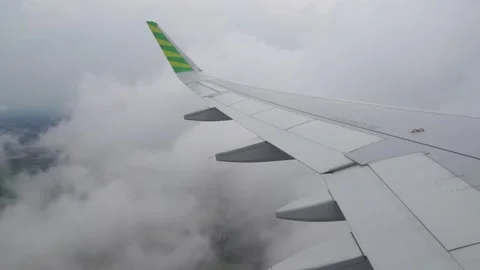 An airplane enters a clump of clouds Video stock 284407030