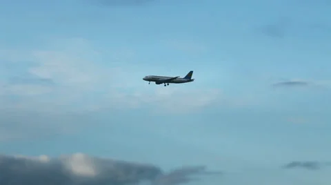 Airplane in the evening sky Stock Footage 36539838