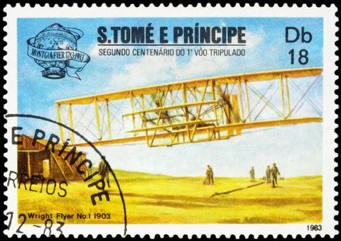 Airplane first flight of the Wright brothers on postage stamp Stock Photos
