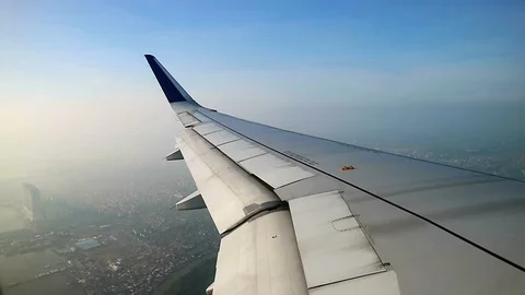 Airplane flaps down for decreasing speed before landing Video stock 92778793