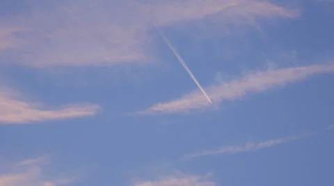 Airplane Flies Overhead through Frame on Clear, Blue Sky Day Stock Footage 68377804