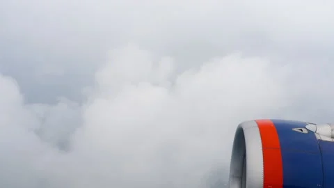 Airplane flies through the clouds Stock Footage 201409639