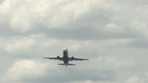 An airplane flies through the sky - slow motion. Stock Footage 44102208