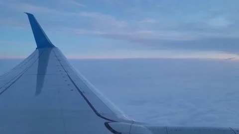 Airplane flight in the clouds. View from the airplane window. Video stock 192984326