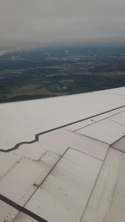 Airplane flight in the clouds. View from the airplane window. Vertical video Video stock 316510240