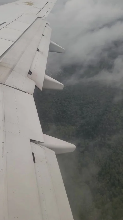 Airplane flight in the clouds. View from the airplane window. Vertical video Stock Footage 316510267