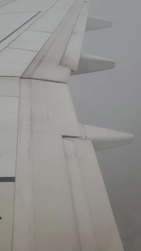 Airplane flight in the clouds. View from the airplane window. Vertical video Stock-Footage 316573120