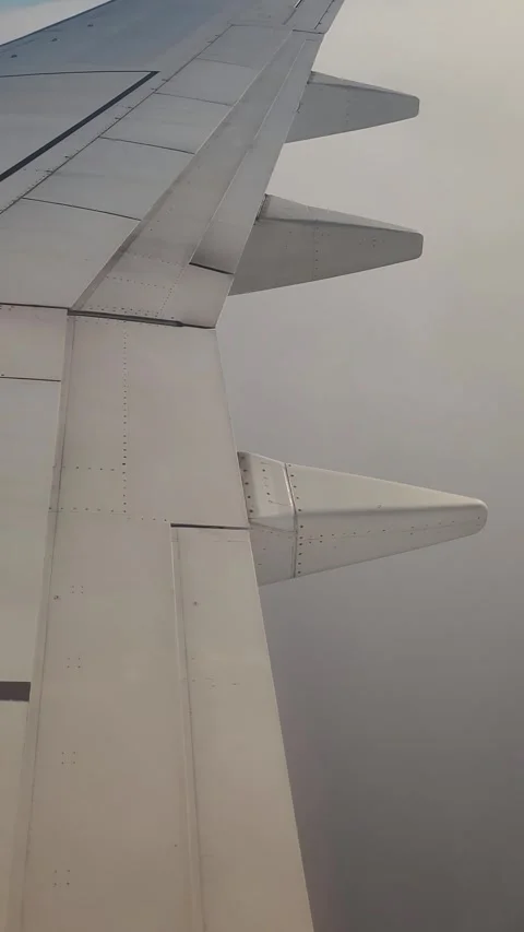 Airplane flight in the clouds. View from the airplane window. Vertical video Stock Footage 316573143