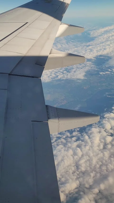 Airplane flight in the clouds. View from the airplane window. Vertical video Stock-Footage 316573241