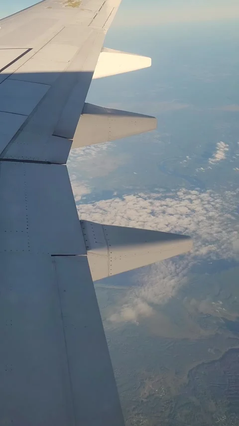 Airplane flight in the clouds. View from the airplane window. Vertical video Stock-Footage 316573242
