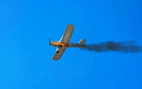 Airplane in flight. The engine of the plane fired. Flames and smoke. Stock Photos