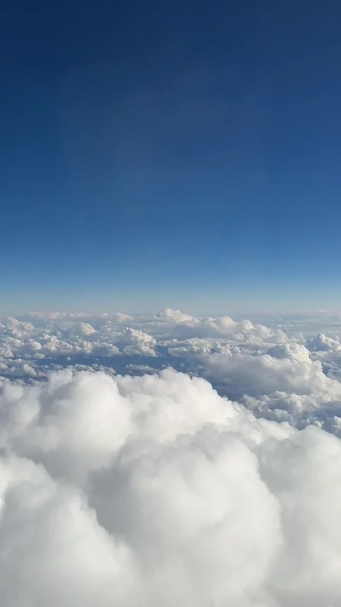 Airplane flight. Flying above the clouds. View from the window of the plane. Stock Footage 241151356
