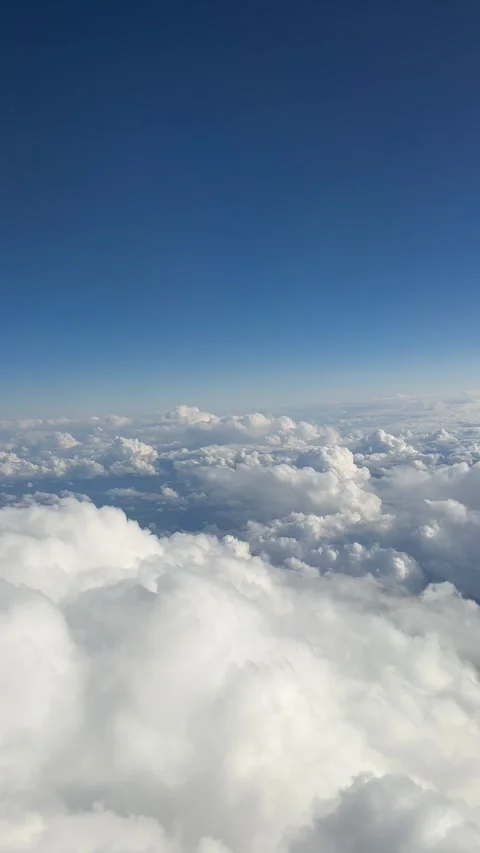 Airplane flight. Flying above the clouds. View from the window of the plane. Stock Footage 241151357