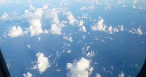 Airplane flight. Flying above the ocean, view through plane window. Stock Footage 218993455