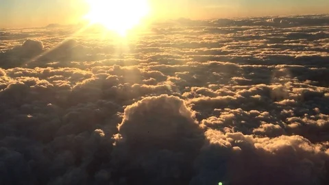 Airplane flight A Jet Plane Flying over sunset clouds View From Window Stock Footage 105470181