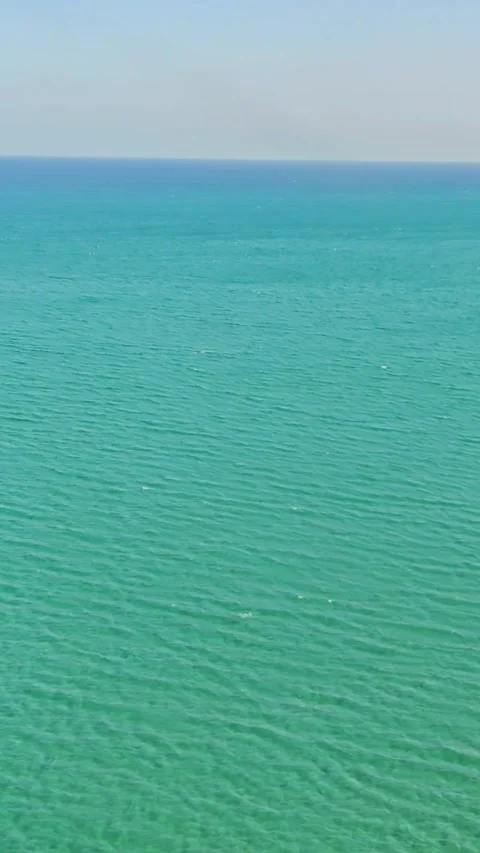 Airplane flight over the sea. View through the plane window. Video stock 309819093