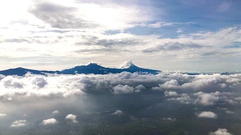 Airplane flight Take-Off A Jet Plane Flying over Mexico clouds View From Window Stock Footage 87729934